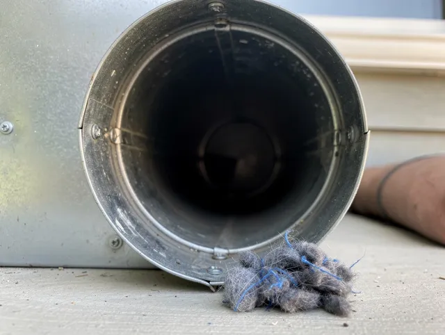 Somers Dryer Vent Cleaning technician using specialized equipment to clear severe dryer vent blockage in Somers